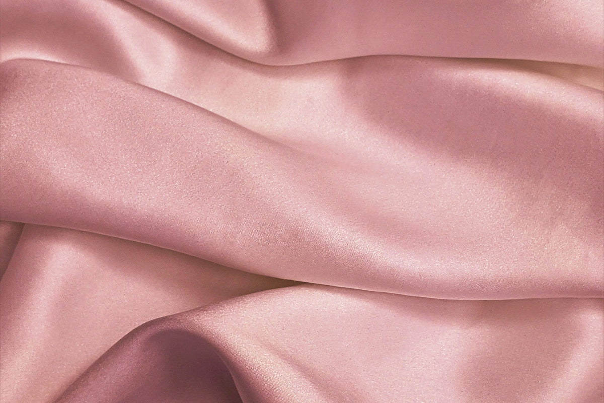Soft pink silk, the cover for a map of the Journal