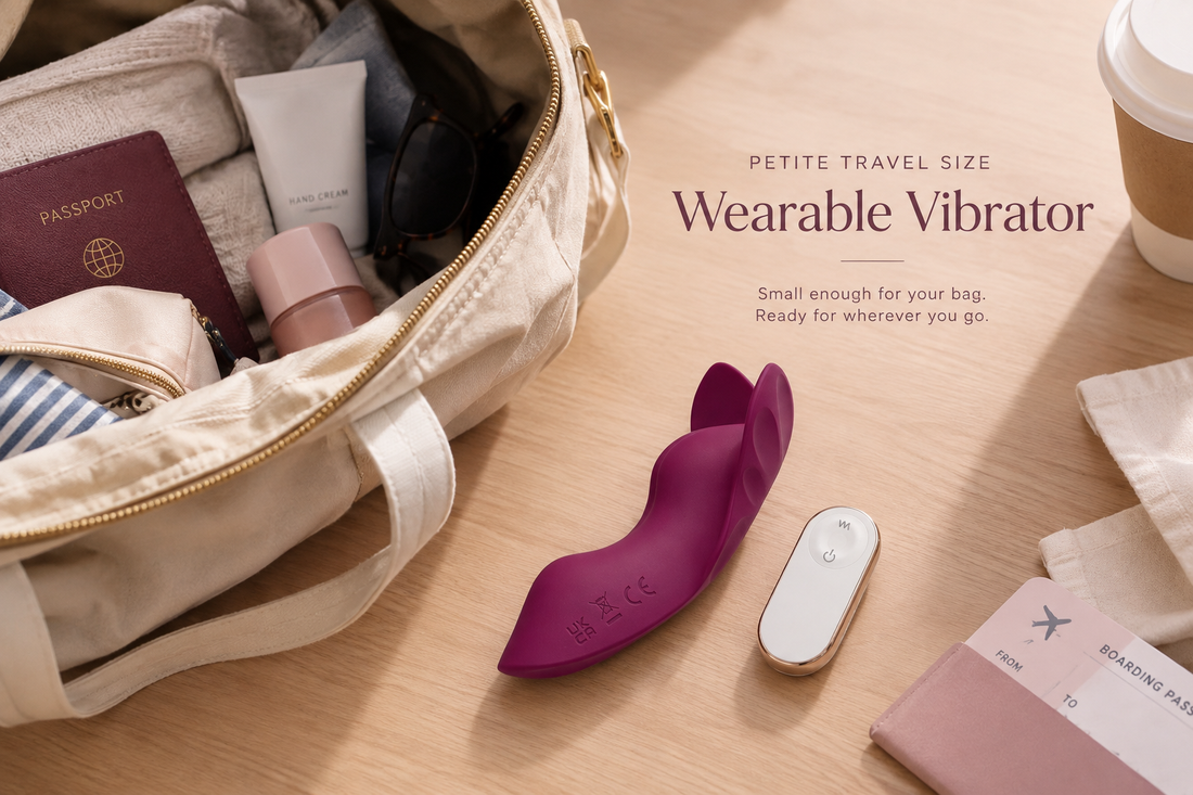 A wearable vibrator packed for travel, next to a passport and a small bag